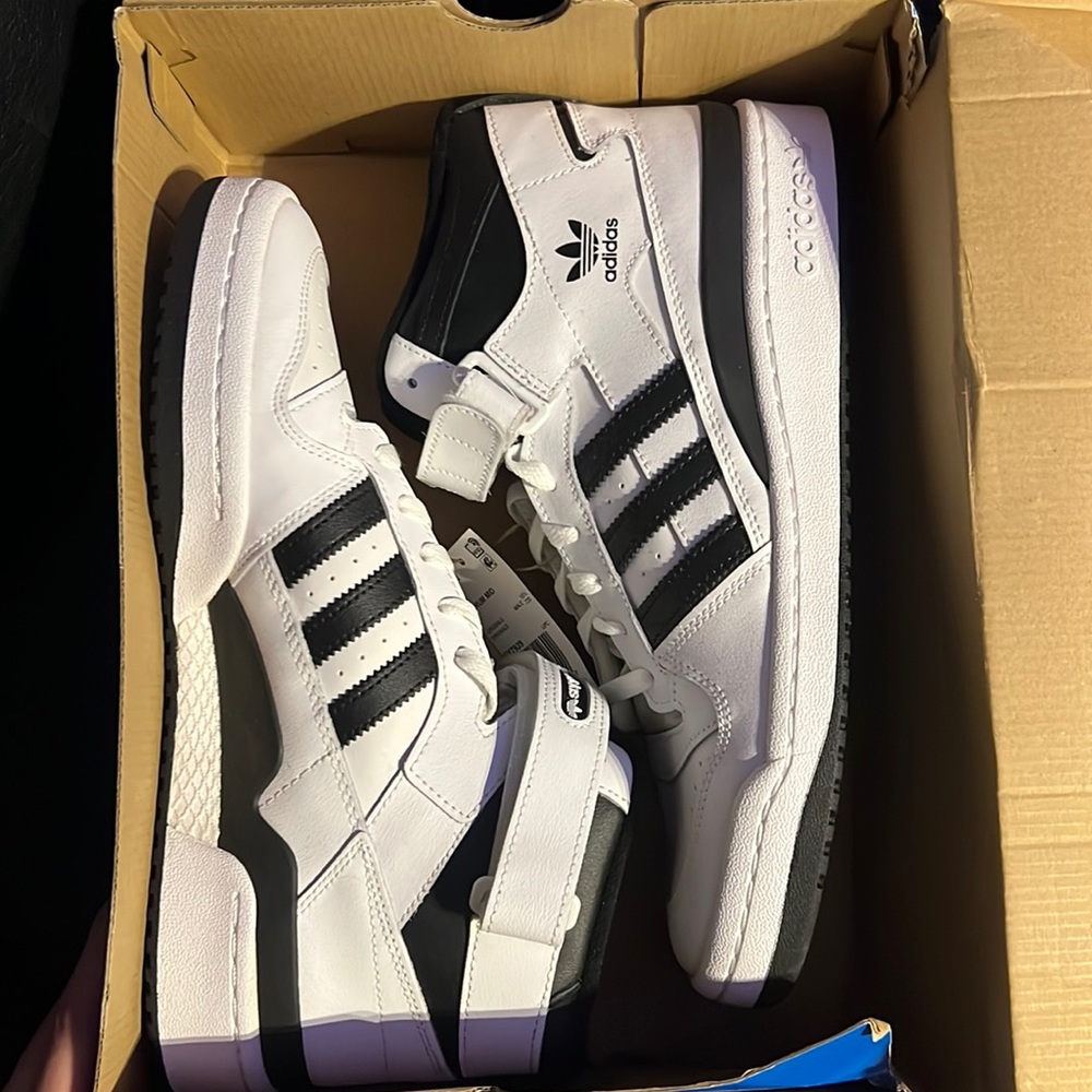 Brand new black and white adidas high tops
